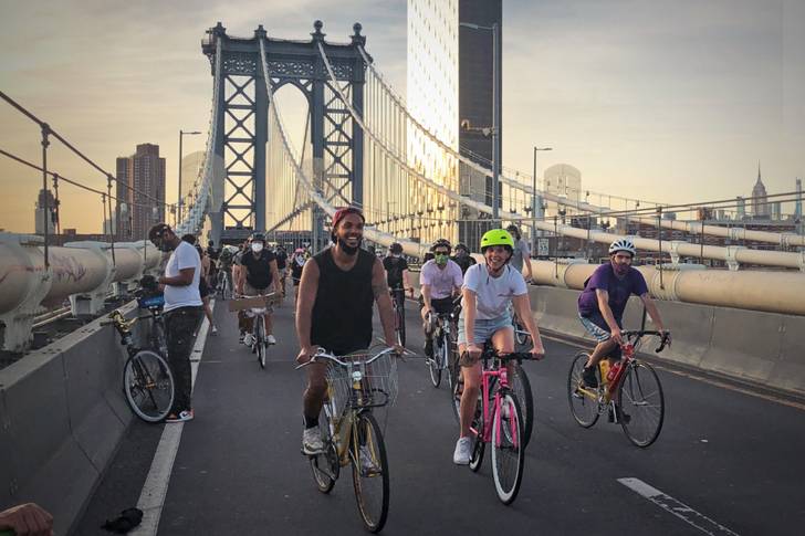 A photo of cyclists crossing the Manhattan Bridge
